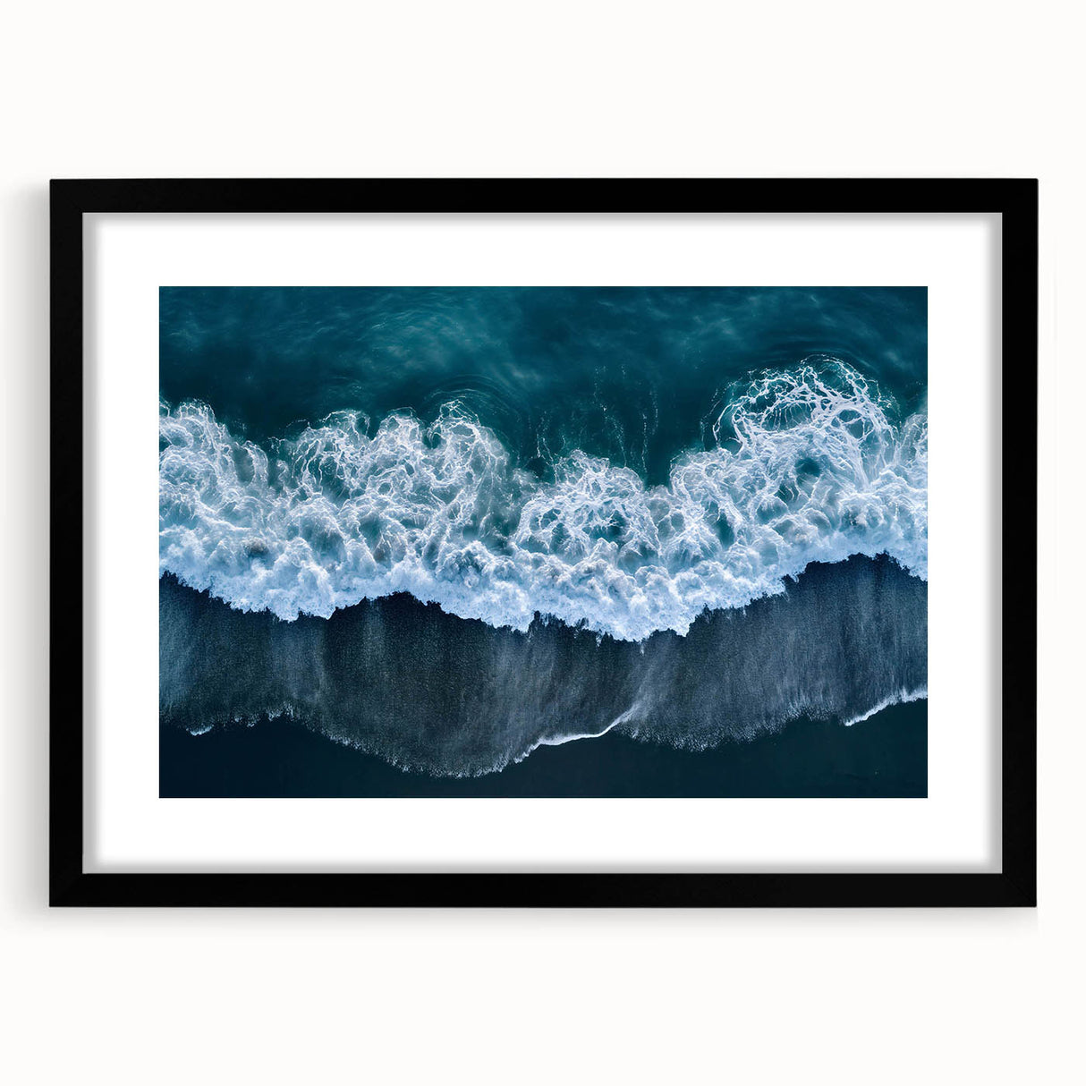 Framed black wall art featuring a serene beach landscape design, showcasing soft waves and a vibrant sunset, ideal for home décor and relaxation themes.