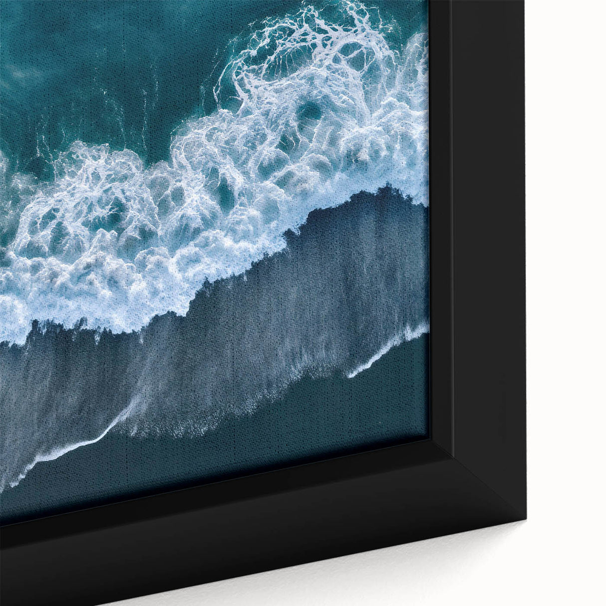 Close-up of a framed canvas wall art piece depicting a serene beach landscape, featuring vibrant colors of blue skies, golden sands, and gentle waves, ideal for home decor.