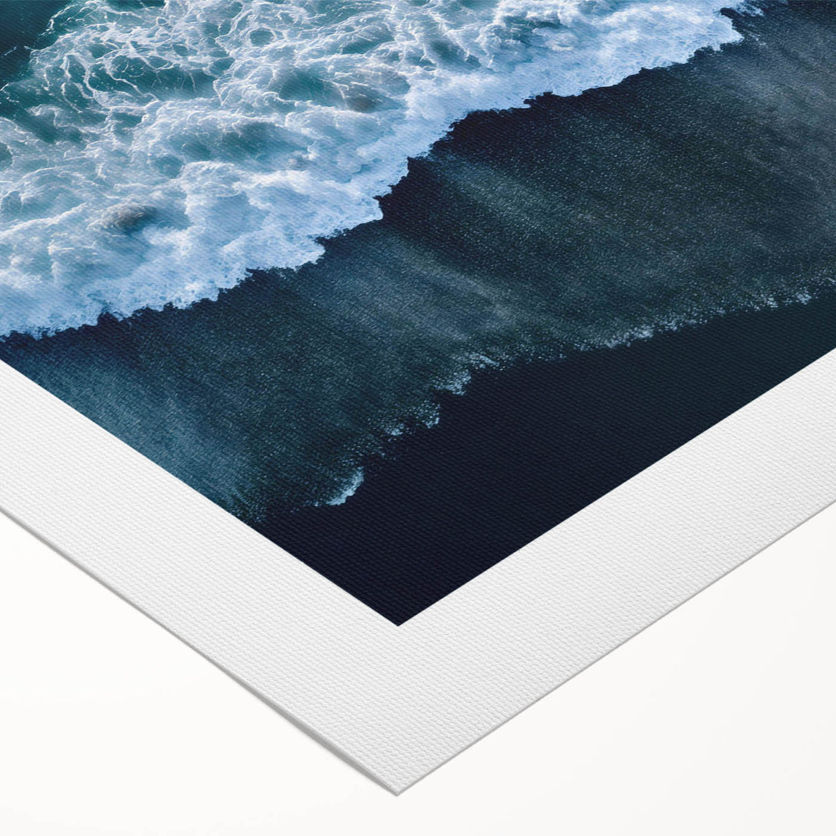 Vibrant rolled canvas artwork depicting a serene beach landscape at sunset, showcasing warm hues of orange, pink, and blue, perfect for coastal home decor.