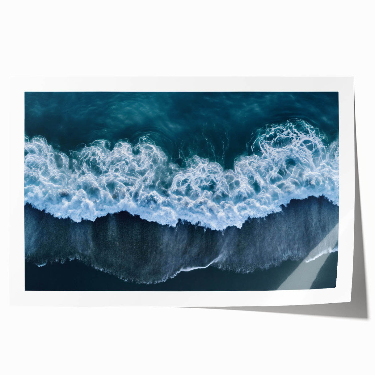 Vibrant rolled print showcasing a serene beach landscape with soft waves and a clear blue sky, ideal for coastal-themed decor. Perfect for enhancing interior spaces.