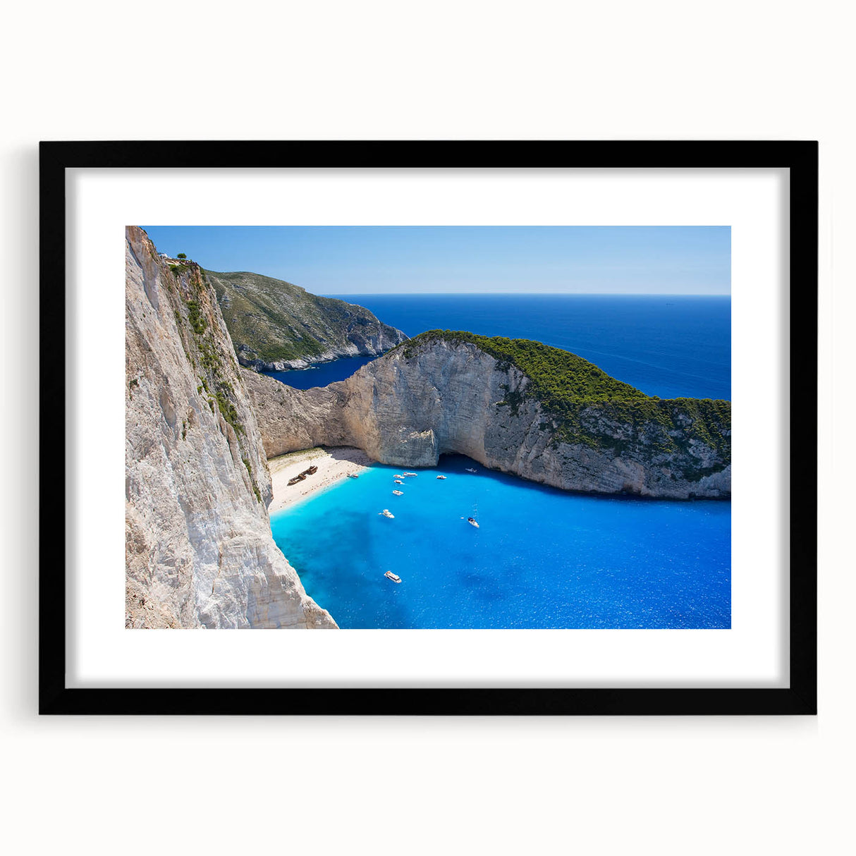 Framed wall art featuring a serene beach landscape, showcasing vibrant colors and a black matting that enhances the visual depth, perfect for home decor.