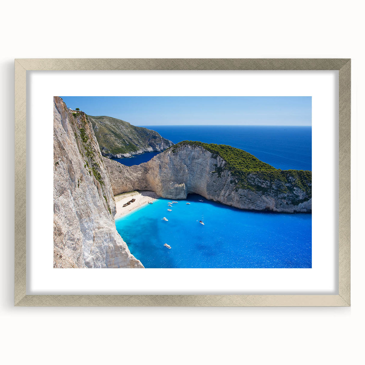 Framed wall art featuring a serene beach landscape design with a silver mat, perfect for enhancing home decor and creating a calming atmosphere.