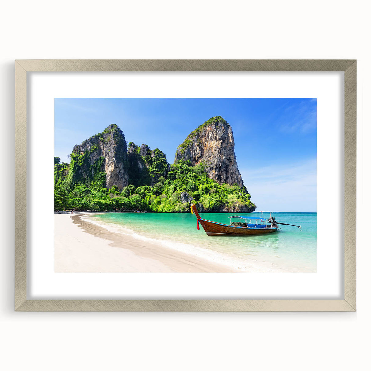 Framed wall art featuring a serene beach landscape design in a silver frame with a mat, perfect for home decor. This elegant piece adds a calming touch to any room.