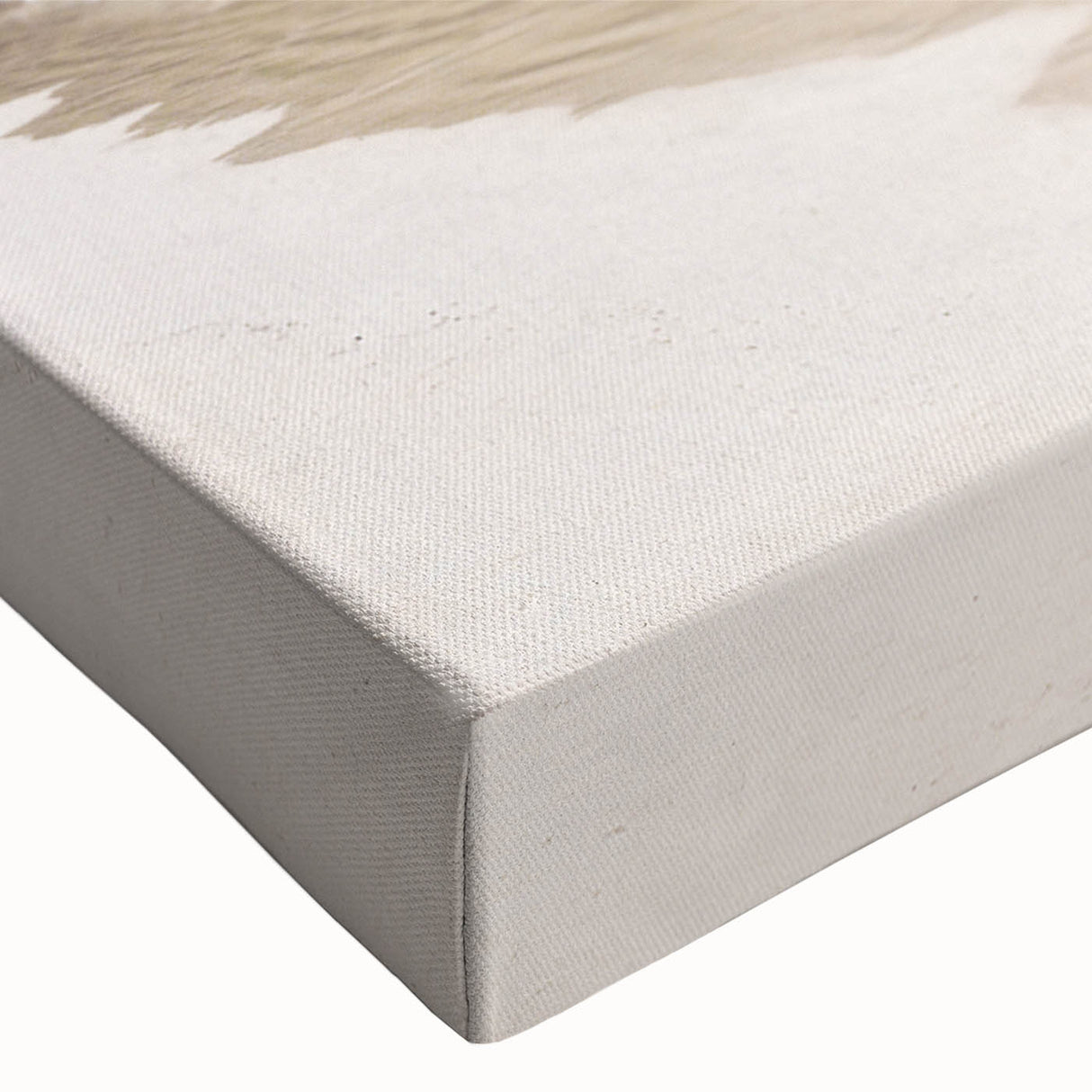 Close-up of a stretched canvas wall art piece depicting a vibrant beach landscape, showcasing rich blues and sandy tones, perfect for coastal decor enthusiasts.