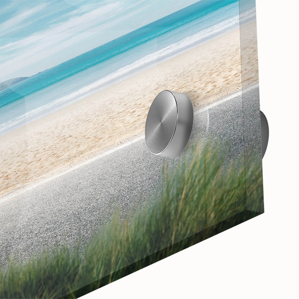 Close-up of a vibrant acrylic glass wall art piece showcasing a serene beach landscape with soft waves and a colorful sunset, ideal for modern home decor.