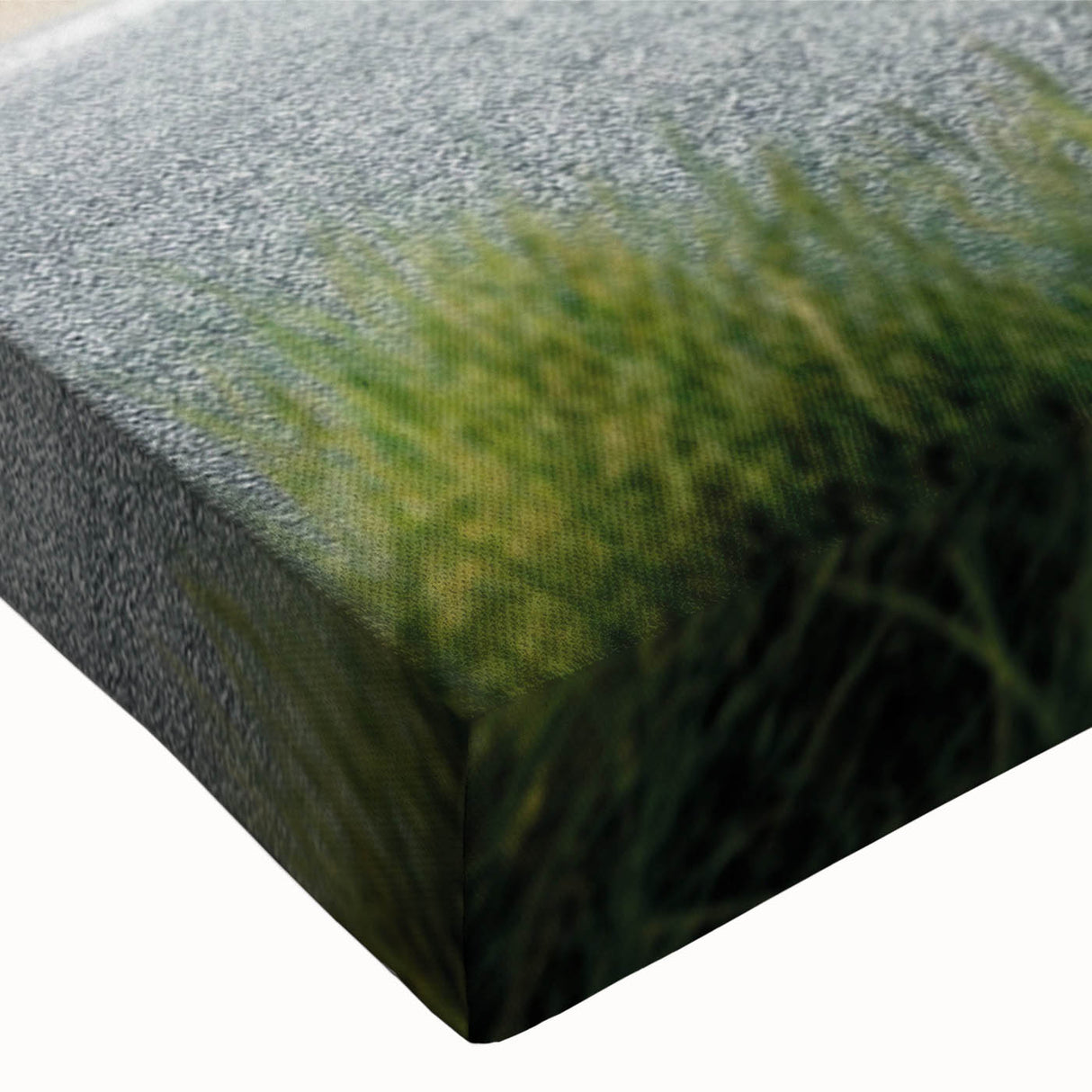 Close-up of a stretched canvas wall art piece showcasing a vibrant beach landscape design, featuring vivid blues and sandy tones, perfect for coastal decor.