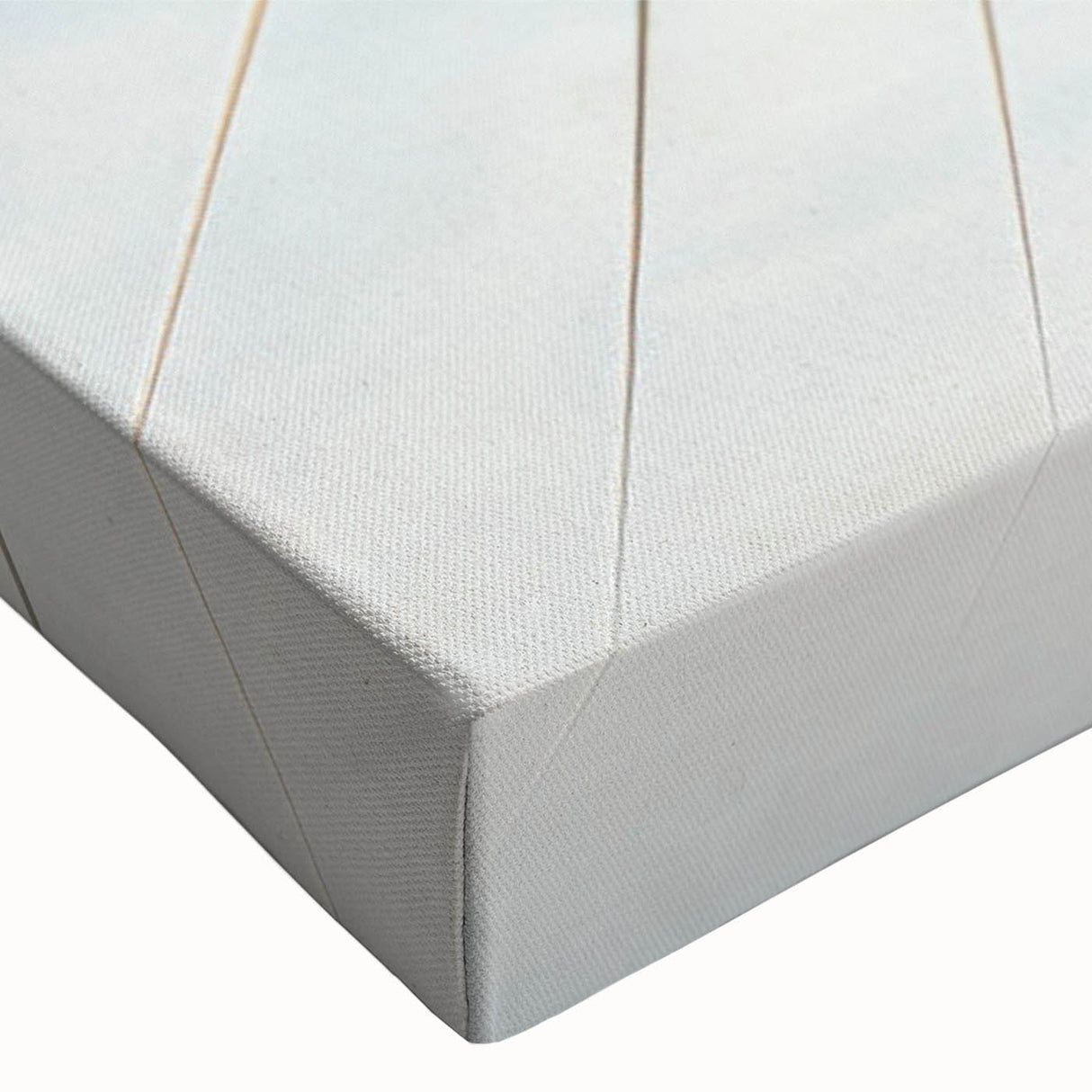 Close-up of a stretched canvas featuring a vibrant landscape design with a bridge, showcasing rich colors and intricate details, perfect for home decor.