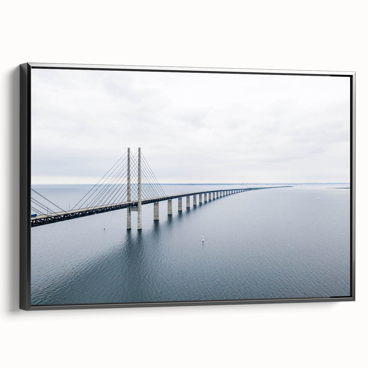 Framed canvas wall art showcasing a serene landscape with a bridge, featuring a modern black frame. Ideal for enhancing home decor with nature-inspired themes.
