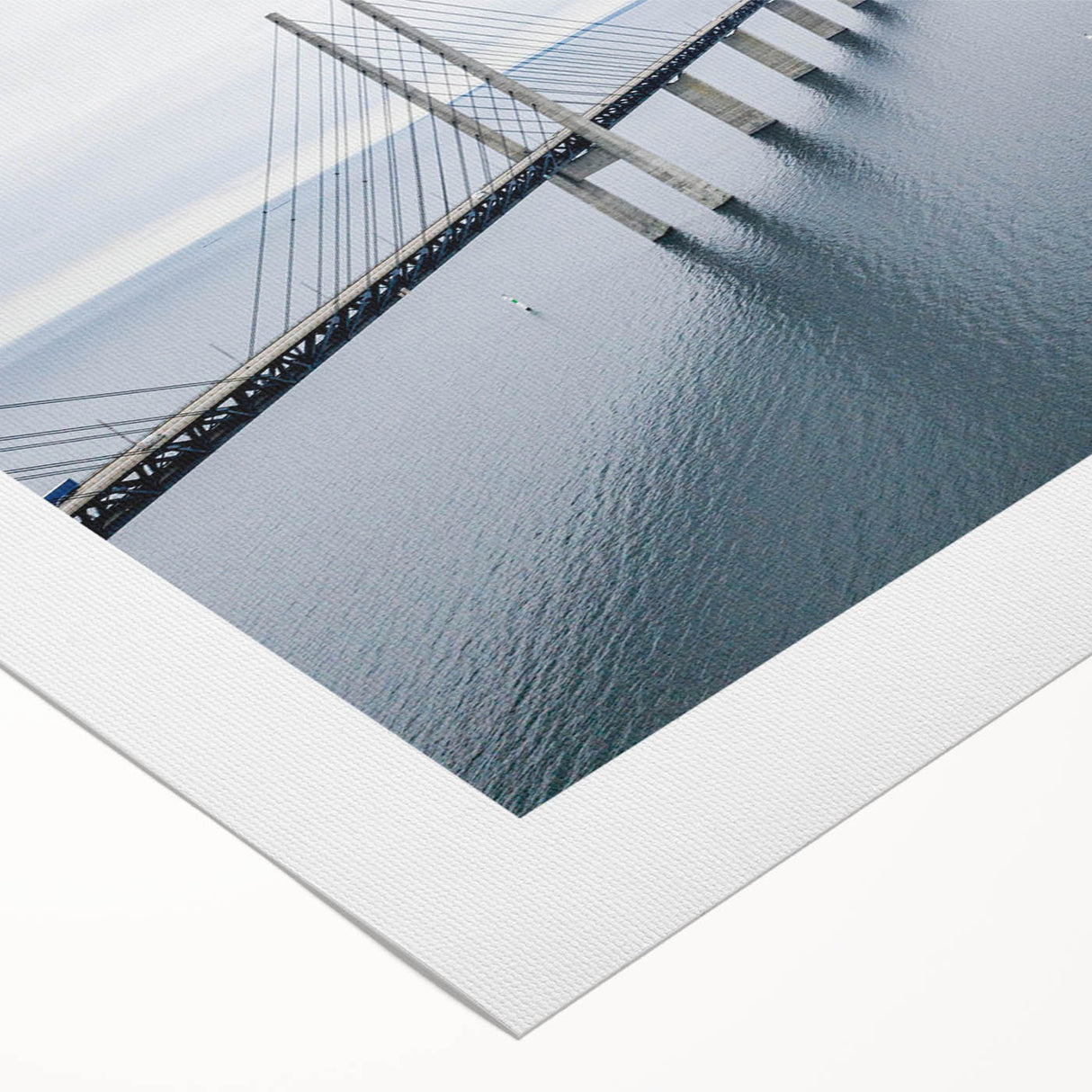 Rolled canvas artwork showcasing a vibrant landscape featuring a serene bridge over a tranquil river, perfect for home decor. The piece emphasizes natural beauty and harmony.