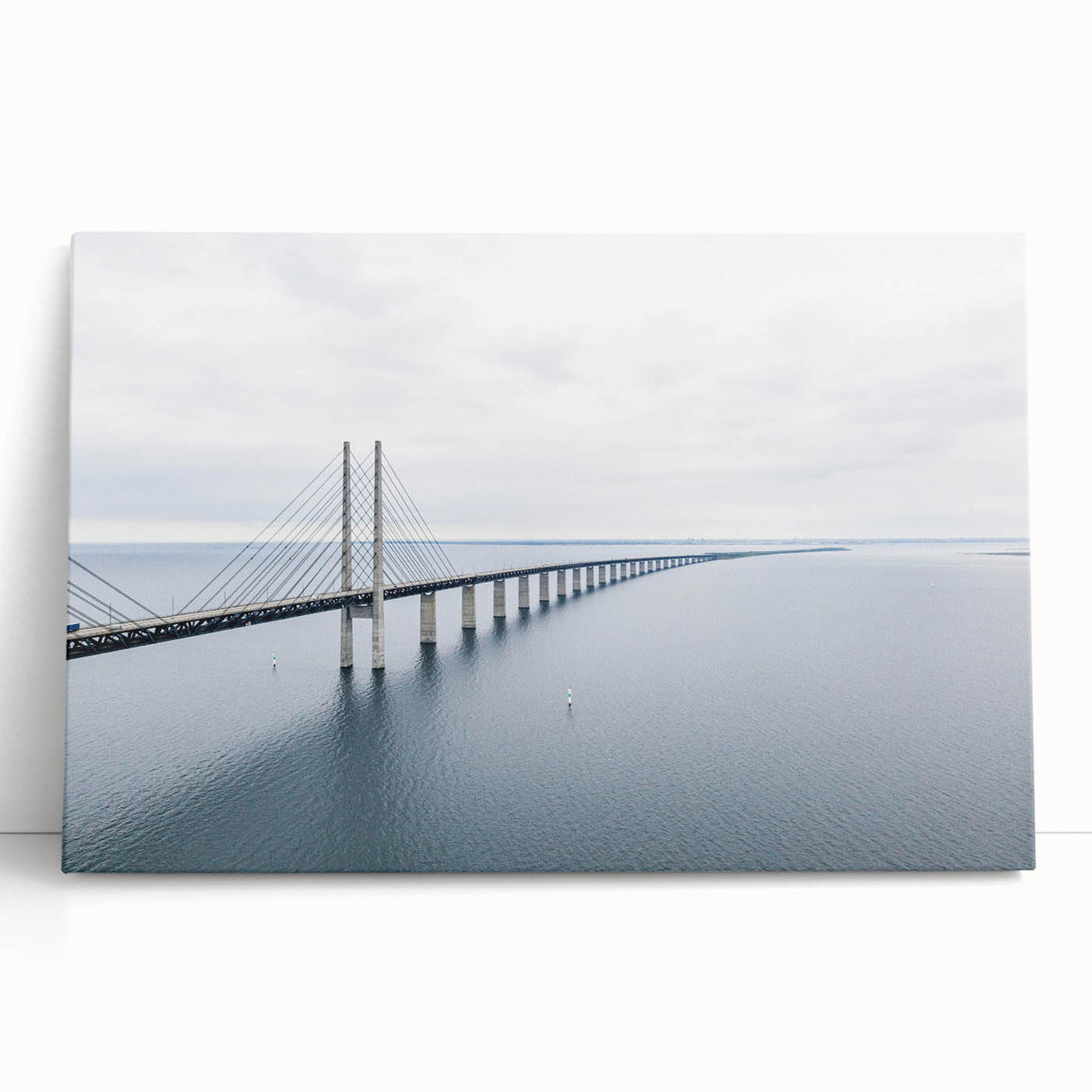 Stretched canvas wall art featuring a serene landscape with a bridge over a tranquil river, showcasing vibrant colors and intricate details, perfect for home decor.