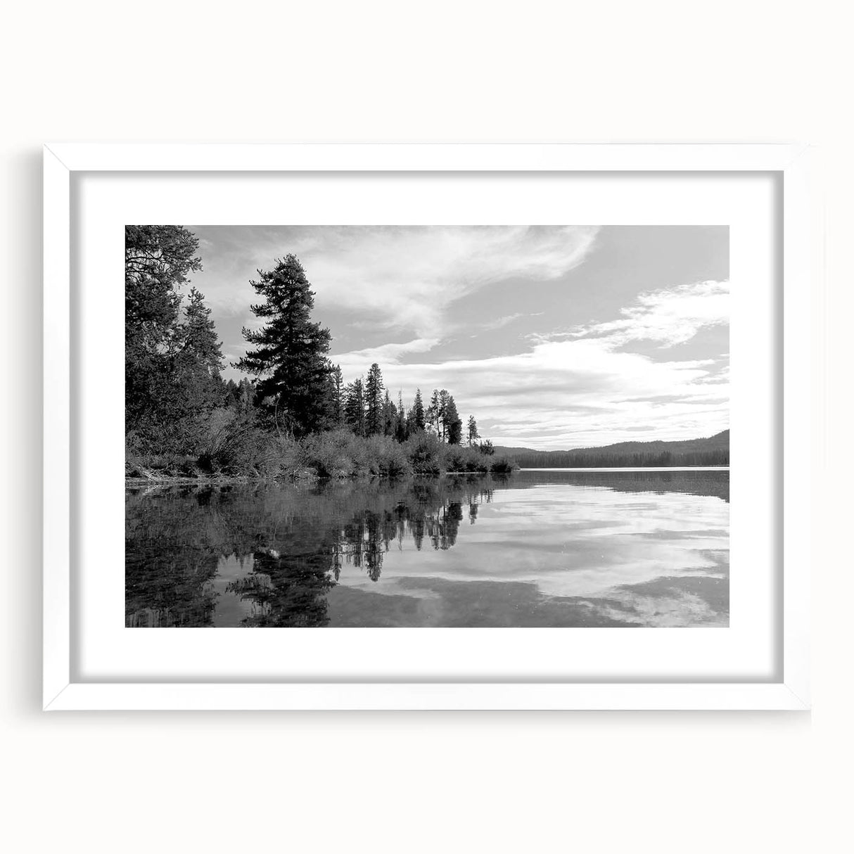 Framed wall art collection showcasing a serene countryside landscape with vibrant green fields and a clear sky, elegantly displayed with a white mat for added contrast and sophistication.