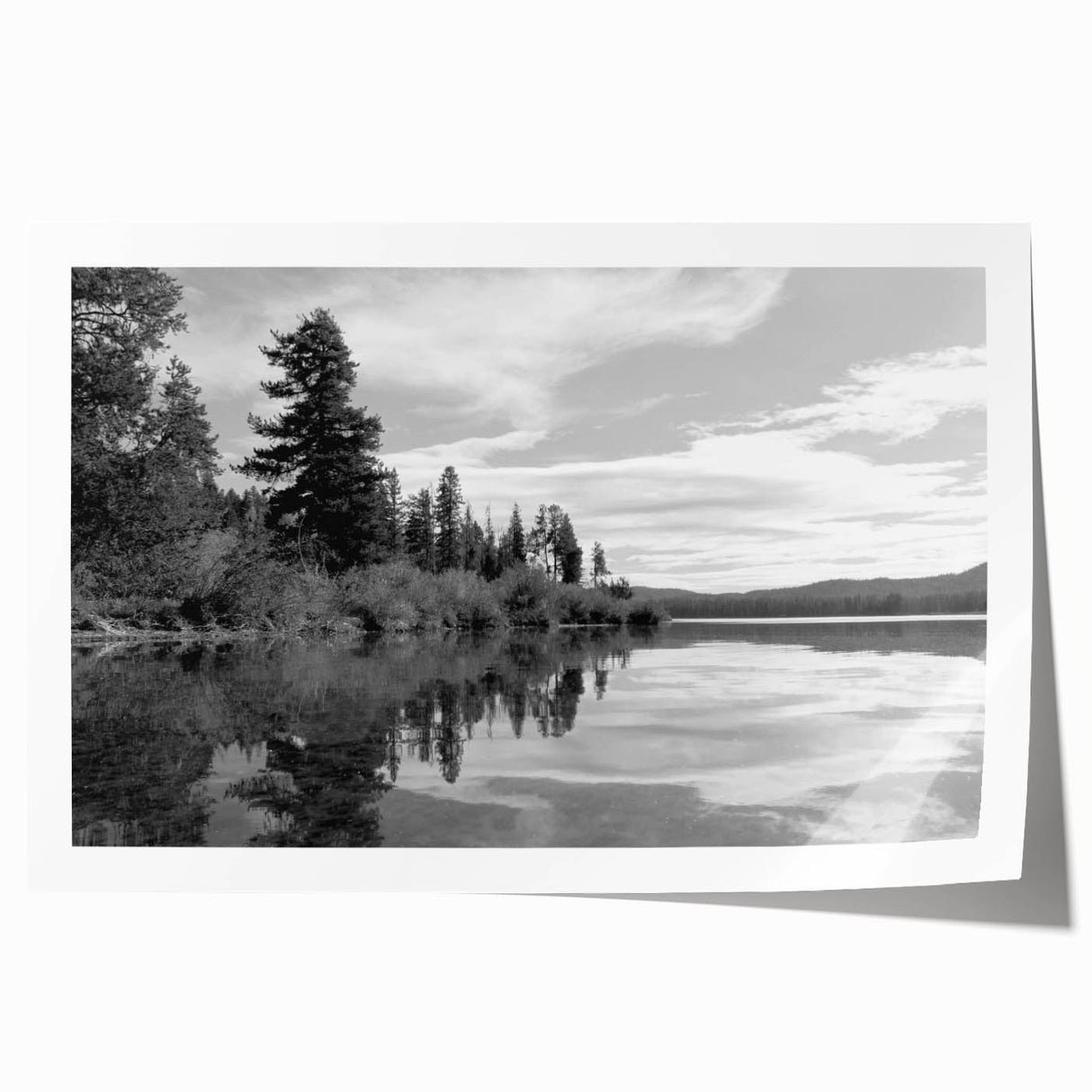 Beautifully designed rolled print of a serene countryside landscape, showcasing vibrant green fields and distant hills, ideal for home decor and art enthusiasts.