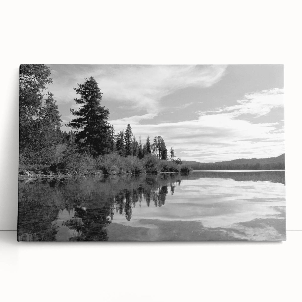 Stretched canvas artwork depicting a serene countryside landscape with rolling hills and vibrant greenery, perfect for home decor in a rustic theme.