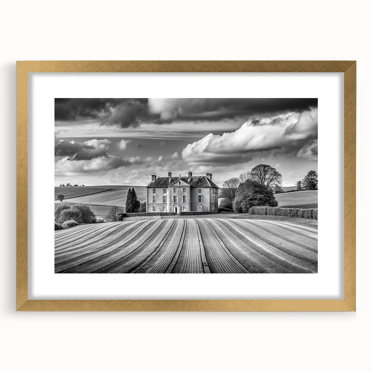 Framed wall art featuring a picturesque country landscape design, showcasing vibrant greens and blues, elegantly outlined with a gold frame and mat. Perfect for enhancing home decor.