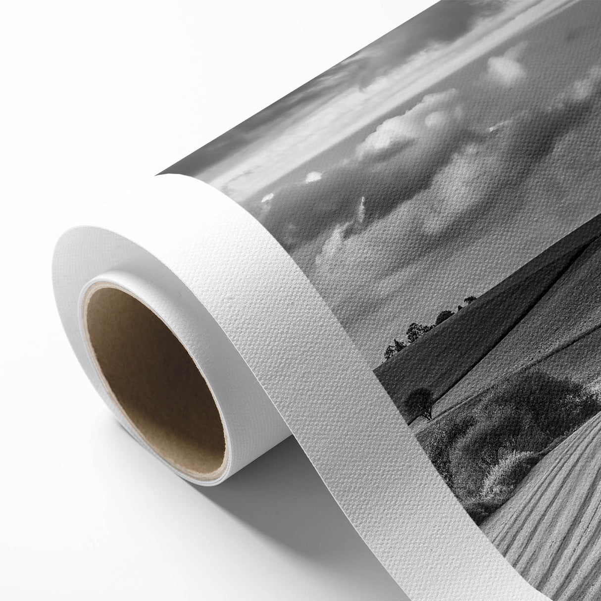 Rolled canvas wall art design showcasing a serene countryside landscape, featuring vibrant greens and blues, ideal for home decor. Packaged securely for delivery.