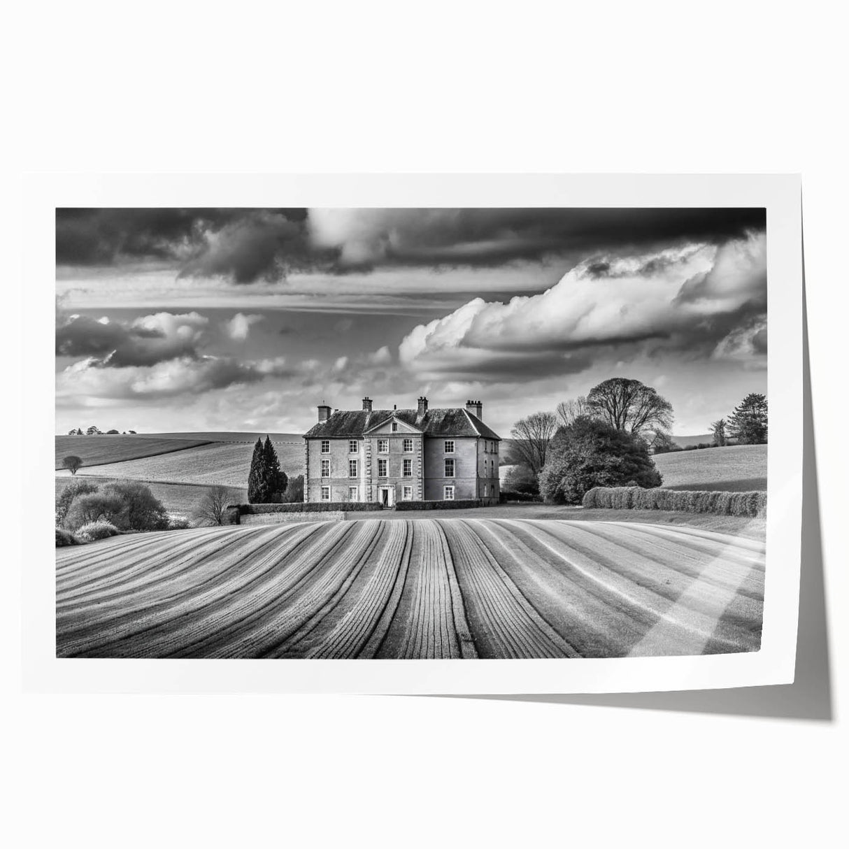 Vibrant rolled print showcasing a serene countryside landscape with rolling hills and a clear blue sky, ideal for home decor and wall art collection.