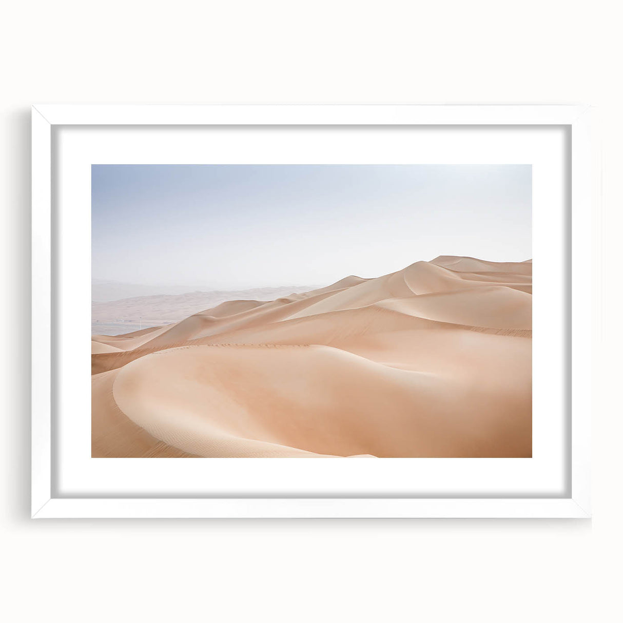 Framed wall art featuring a serene desert landscape design, with a white mat and sleek frame, perfect for enhancing modern home decor.