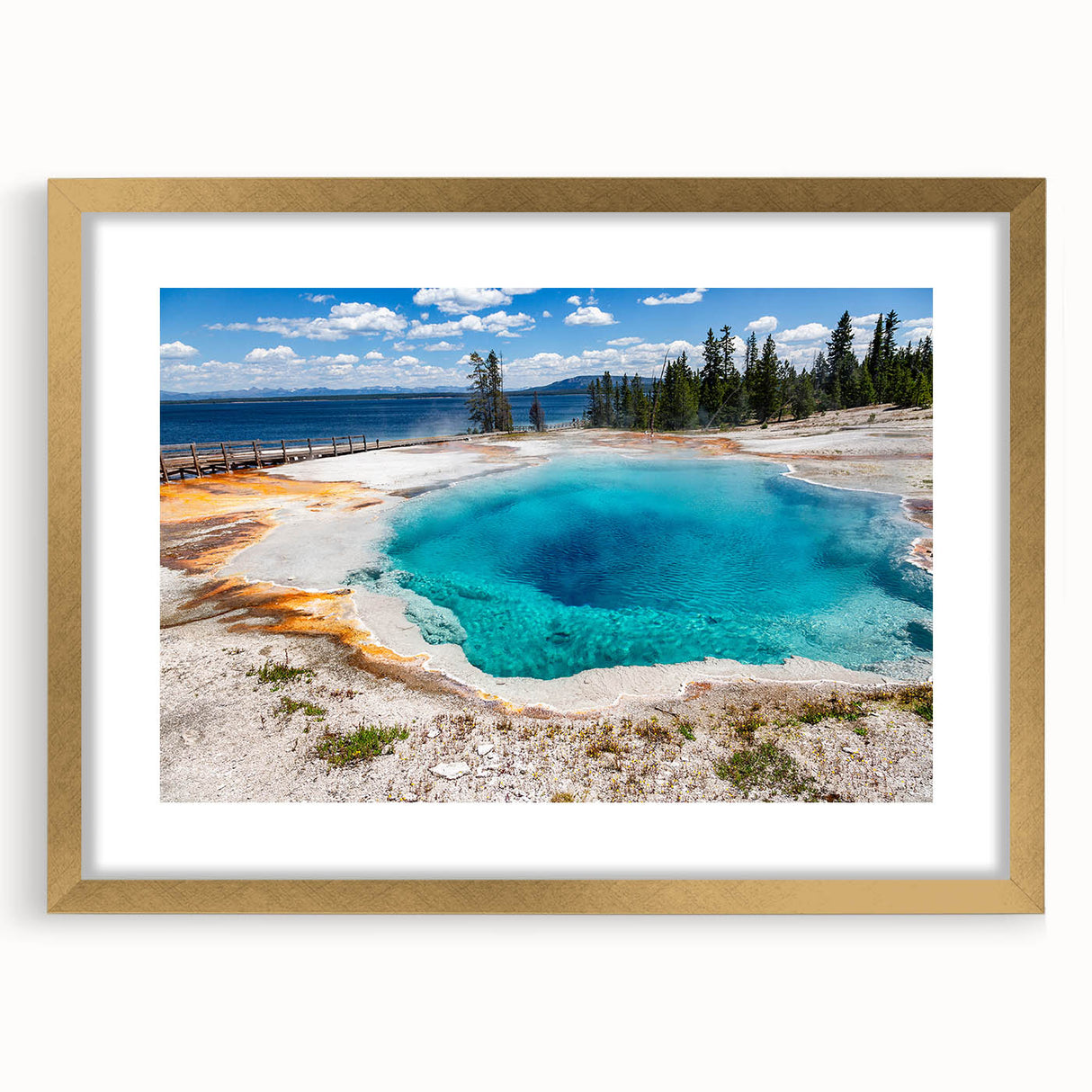 Framed wall art featuring a geyser landscape design, showcasing vibrant colors and intricate details, accented by a gold mat for an elegant finish. Ideal for home decor enhancement.
