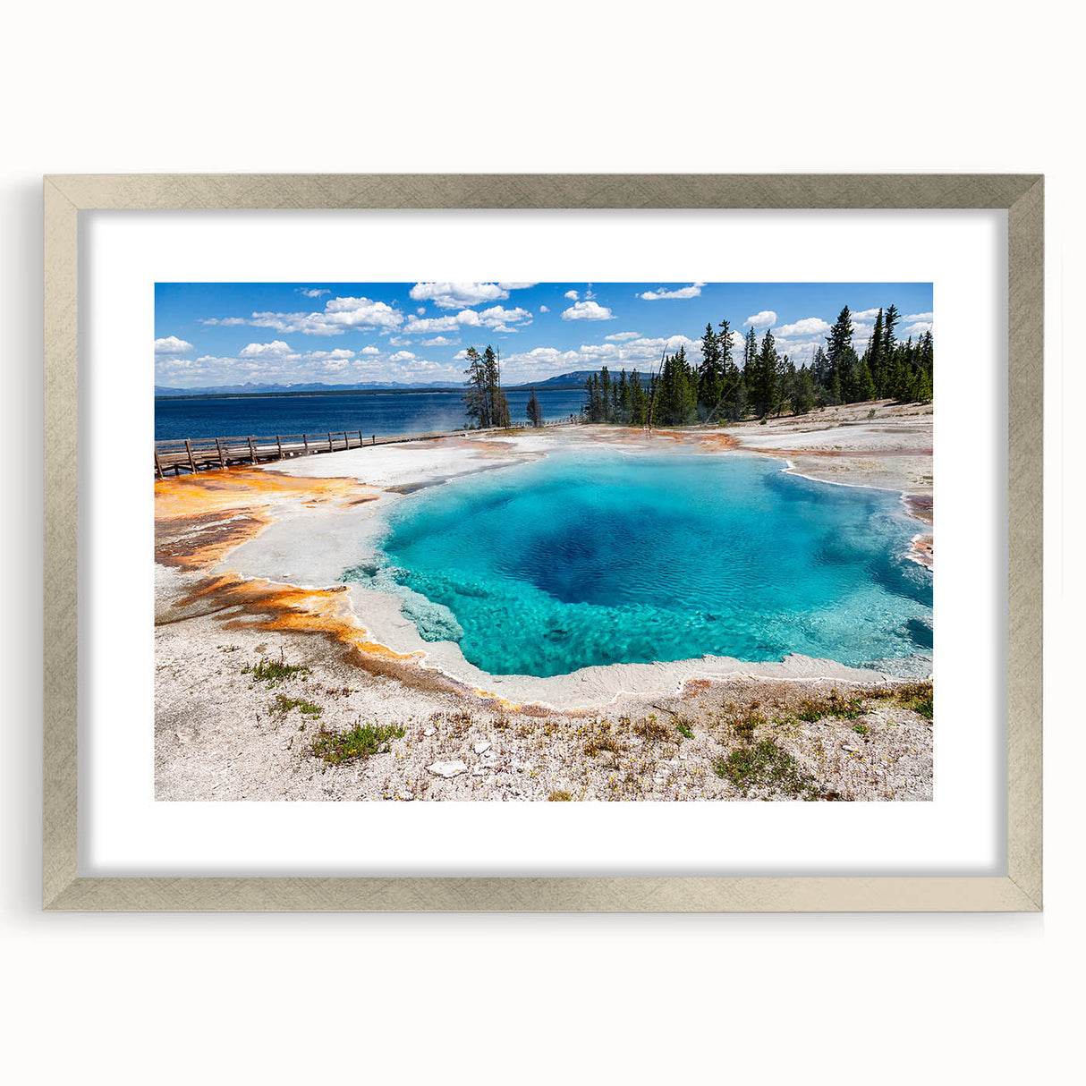 Silver-framed landscape wall art featuring a geyser design, elegantly matted to enhance visual appeal. Perfect for modern home decor, adding a touch of nature-inspired elegance.