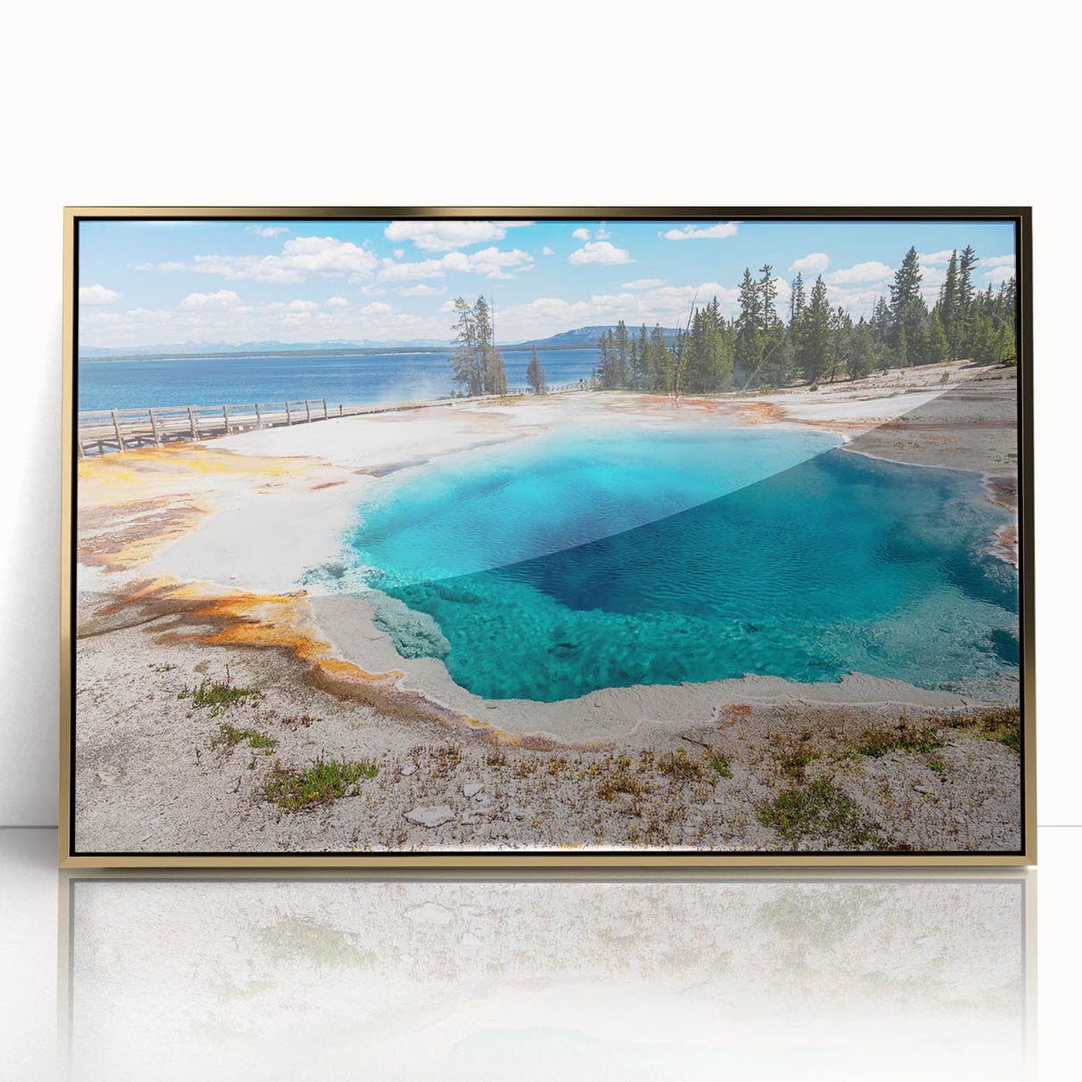 Framed acrylic wall art featuring a striking geyser landscape design in vibrant colors, showcased against a sleek gold frame, perfect for modern decor.
