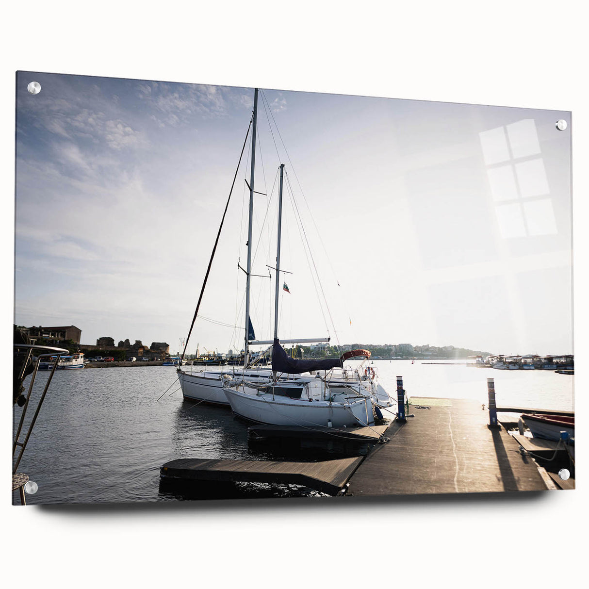 Acrylic glass wall art showcasing a vibrant harbor landscape design, viewed from the side with decorative pins, ideal for enhancing modern interior decor.