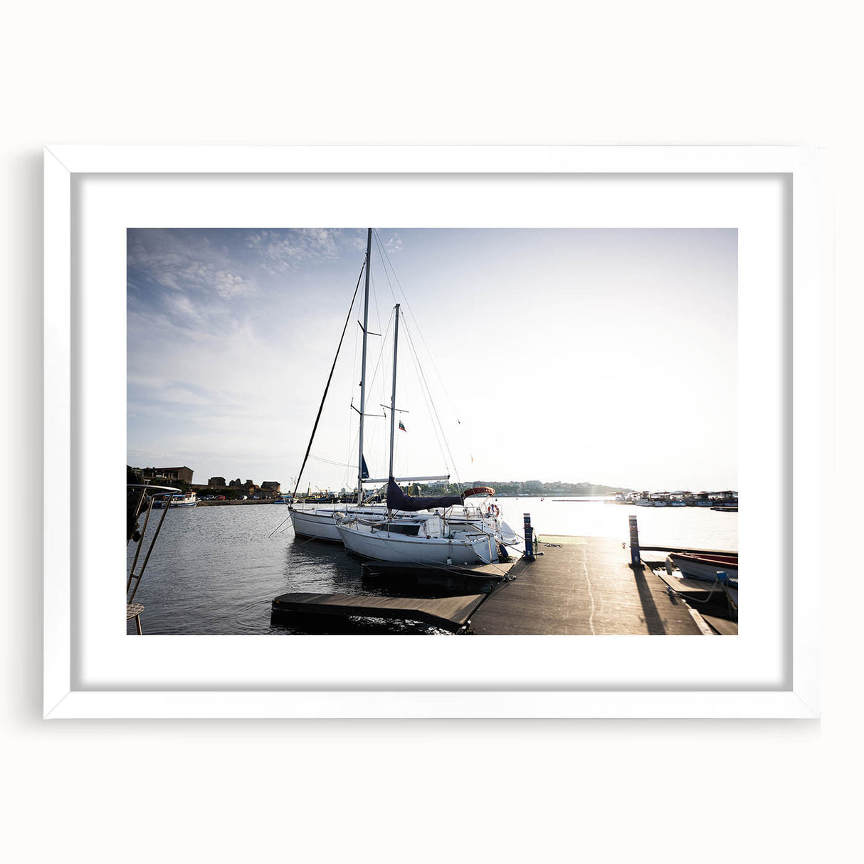 Framed wall art from the Harbor Design collection showcasing a serene landscape scene with soft colors, perfect for home decor. The white mat enhances its elegance.