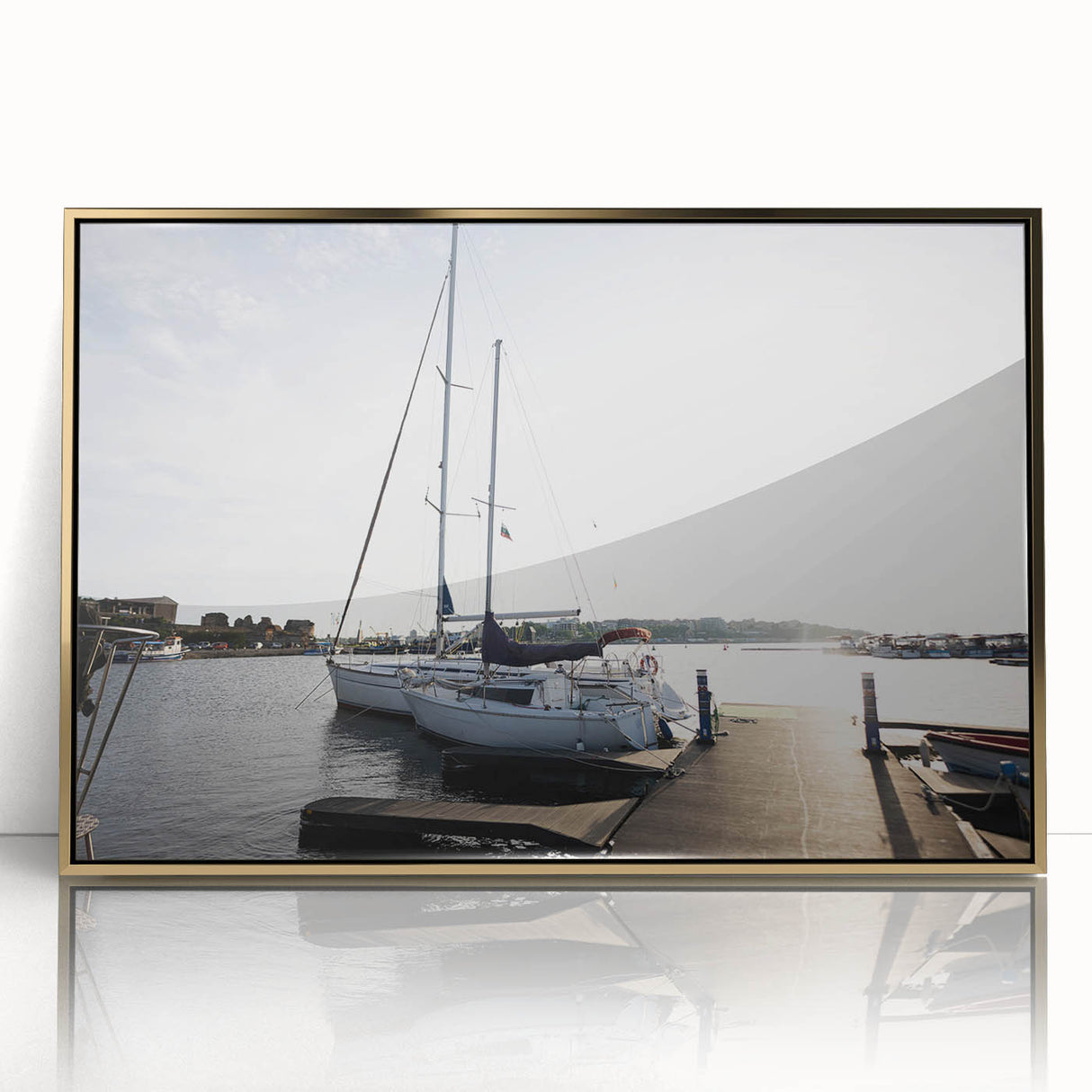 Framed acrylic wall art featuring a serene harbor landscape design with golden accents, showcasing tranquil water reflections and vibrant colors, perfect for modern decor.