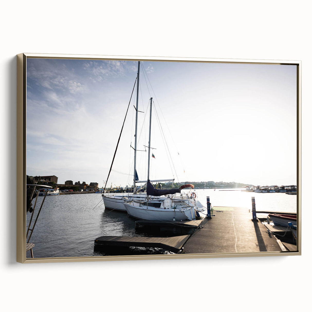 Framed canvas wall art showcasing a serene harbor landscape design with golden accents, ideal for enhancing modern home decor and creating a calming atmosphere.