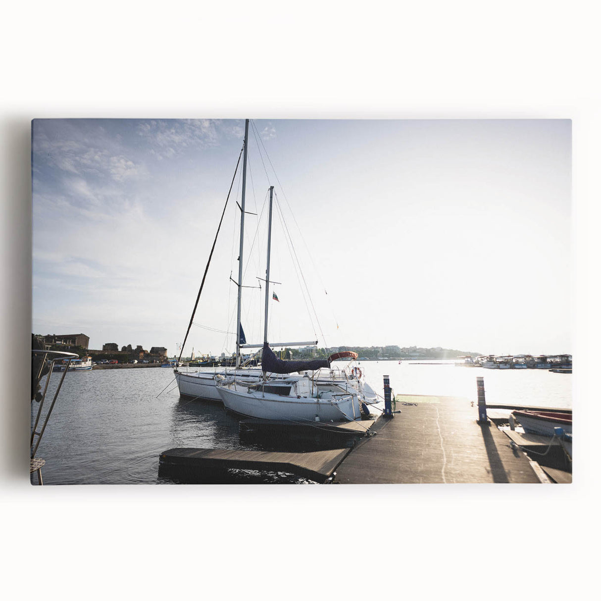 Stretched canvas wall art depicting a serene harbor landscape with vibrant colors and soft waves, perfect for enhancing home decor and creating a calming atmosphere.
