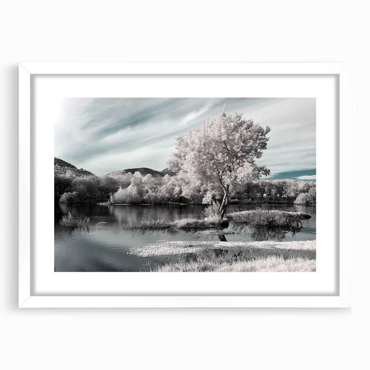 Framed wall art collection featuring serene lake landscapes, displayed in a sleek white frame with a mat, perfect for home decor or office settings.