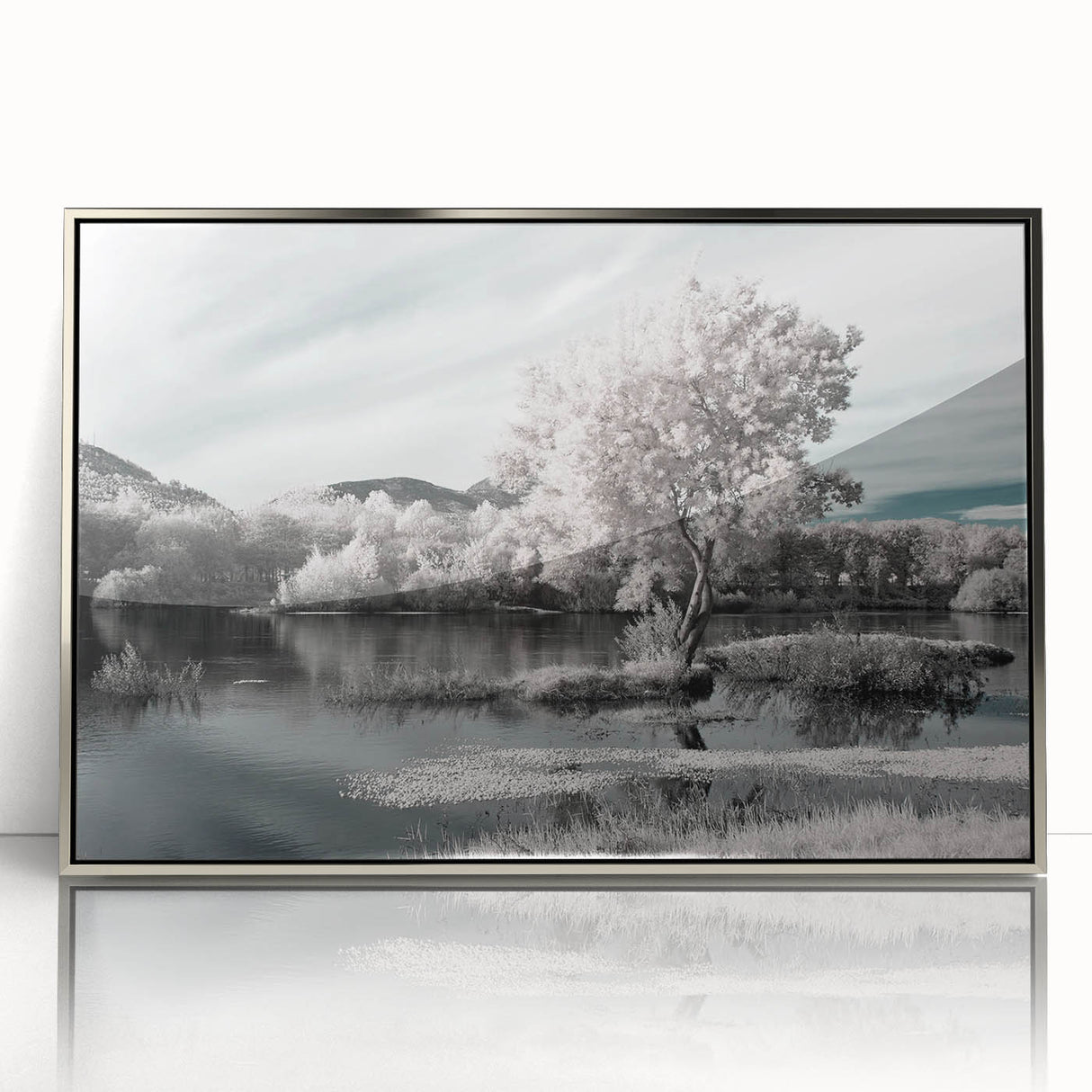 Framed wall art showcasing a serene lakeside landscape with vibrant colors and intricate details, set against a sleek silver frame, perfect for home decor.