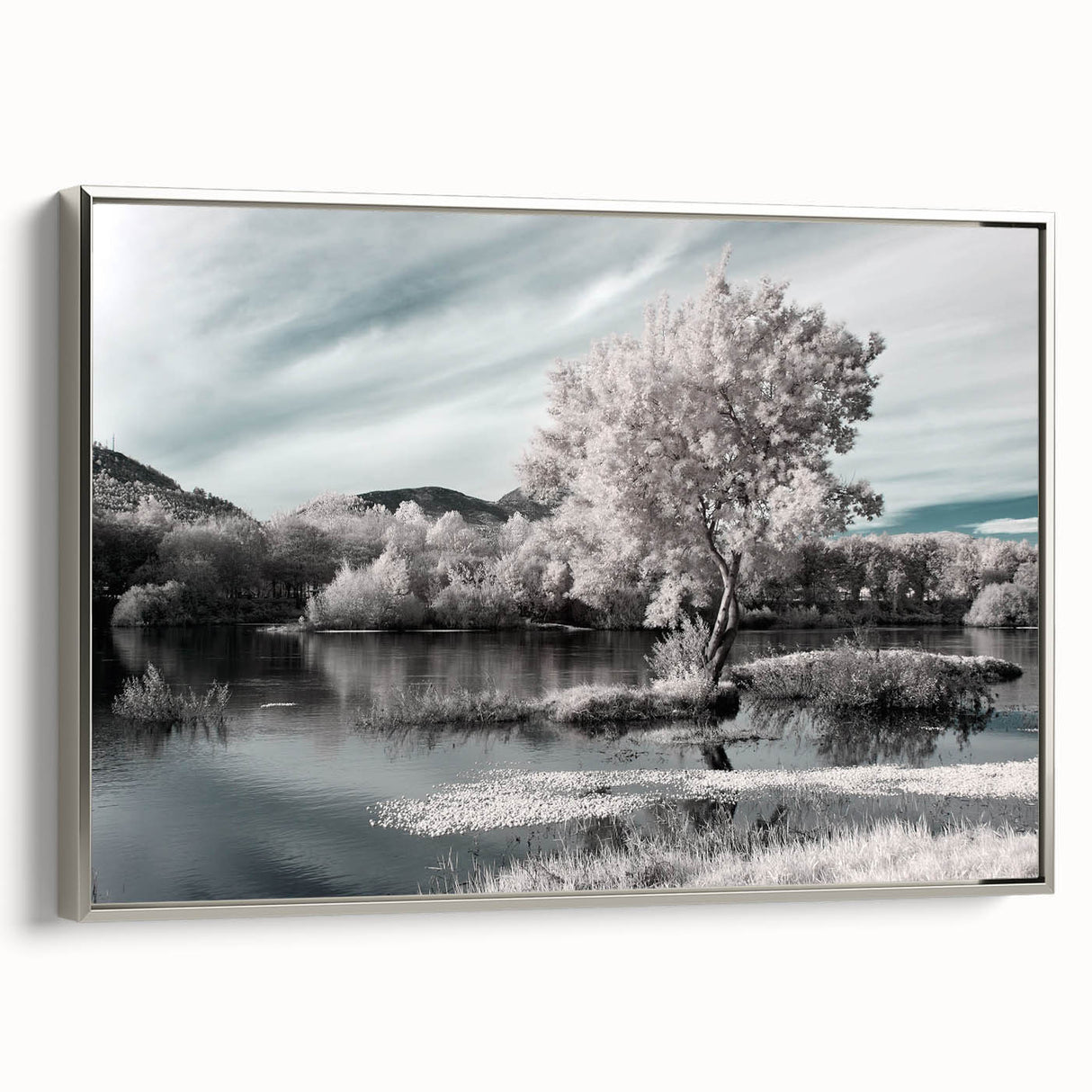 Framed canvas wall art showcasing a serene lake landscape design with silver accents, ideal for home decor. Side view highlights the elegant framing and artistic details.