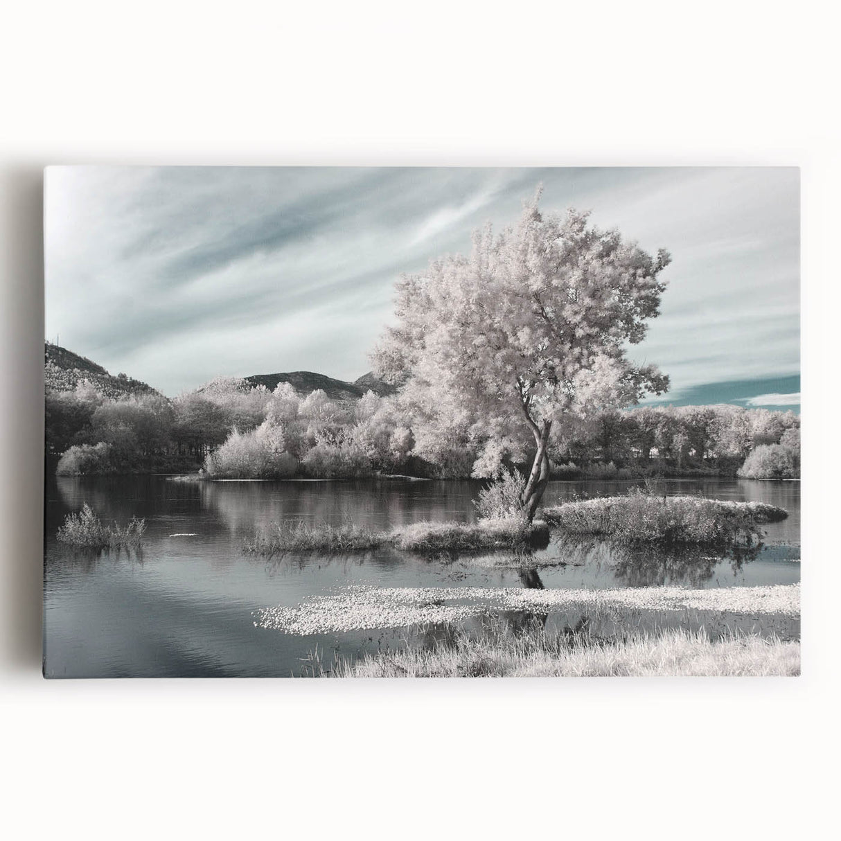 Stretched canvas wall art depicting a serene lake landscape with vibrant blues and greens, perfect for adding a calming touch to home decor.