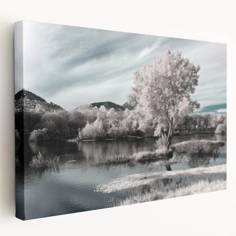 Stretched canvas wall art featuring a serene lake landscape design in vibrant blues and greens, ideal for home decor. The side view showcases its depth and texture, perfect for enhancing any room's ambiance.