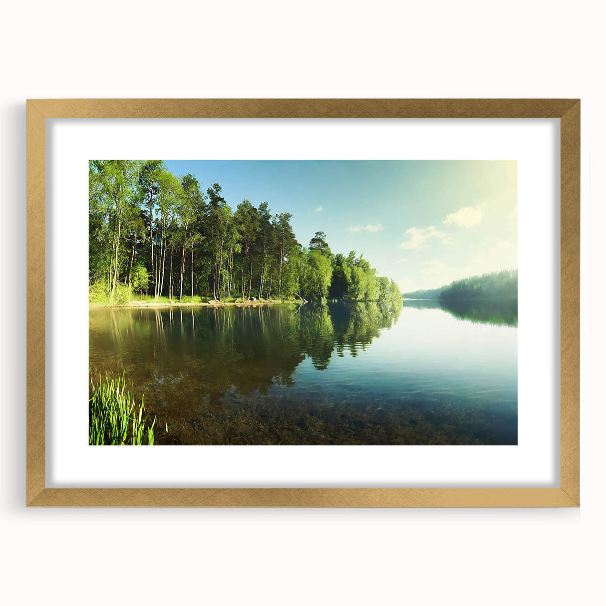 Framed wall art featuring a serene lake landscape design with a gold mat, highlighting vibrant blues and greens, perfect for enhancing home decor aesthetics.