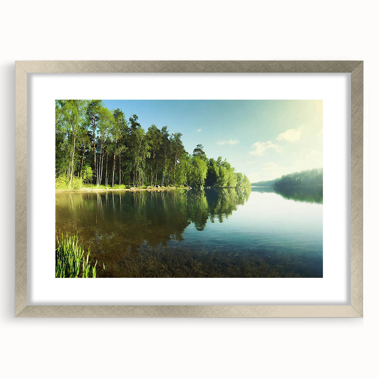 Framed wall art featuring a serene landscape lake design, encased in a silver frame with a mat, perfect for enhancing home decor and creating a calming atmosphere.