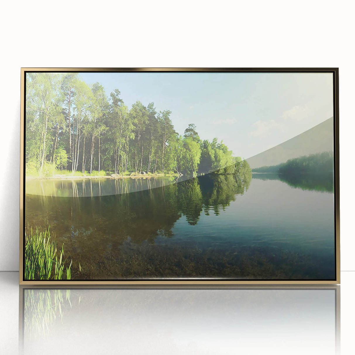 Framed acrylic wall art showcasing a serene landscape with a tranquil lake, surrounded by lush greenery, and accented by a gold frame, perfect for home decor.