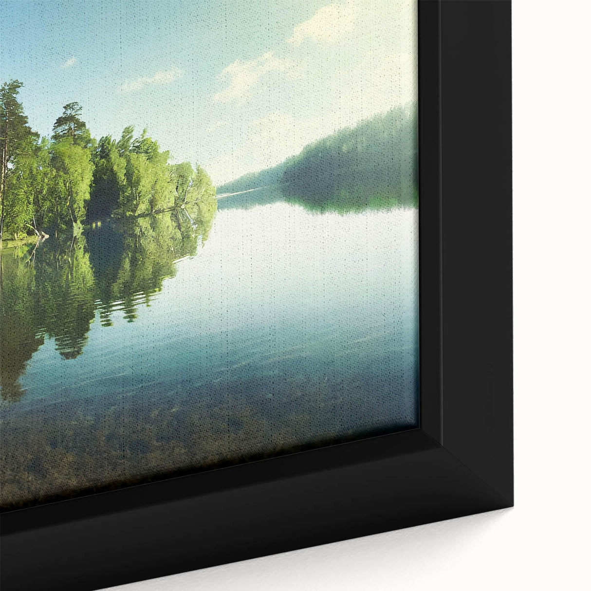 Close-up of a framed canvas wall art piece depicting serene lake landscapes with vibrant colors, perfect for enhancing home decor in living spaces.