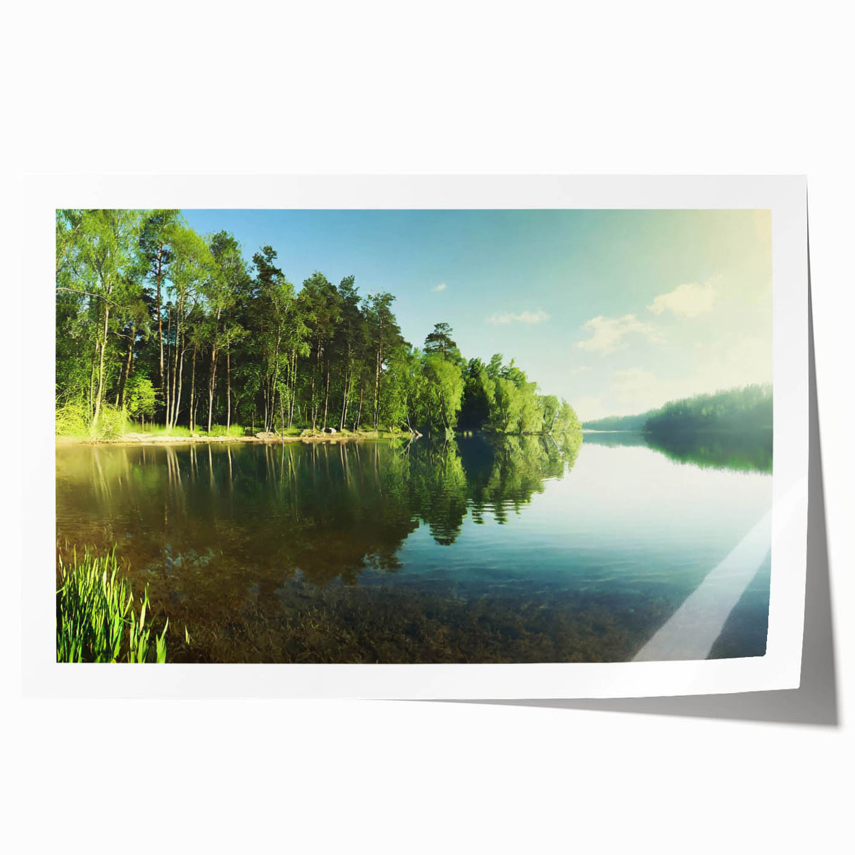 Vibrant landscape lake wall art print showcasing serene blue waters and lush greenery, rolled and packaged in a protective cardboard tube for easy shipping.