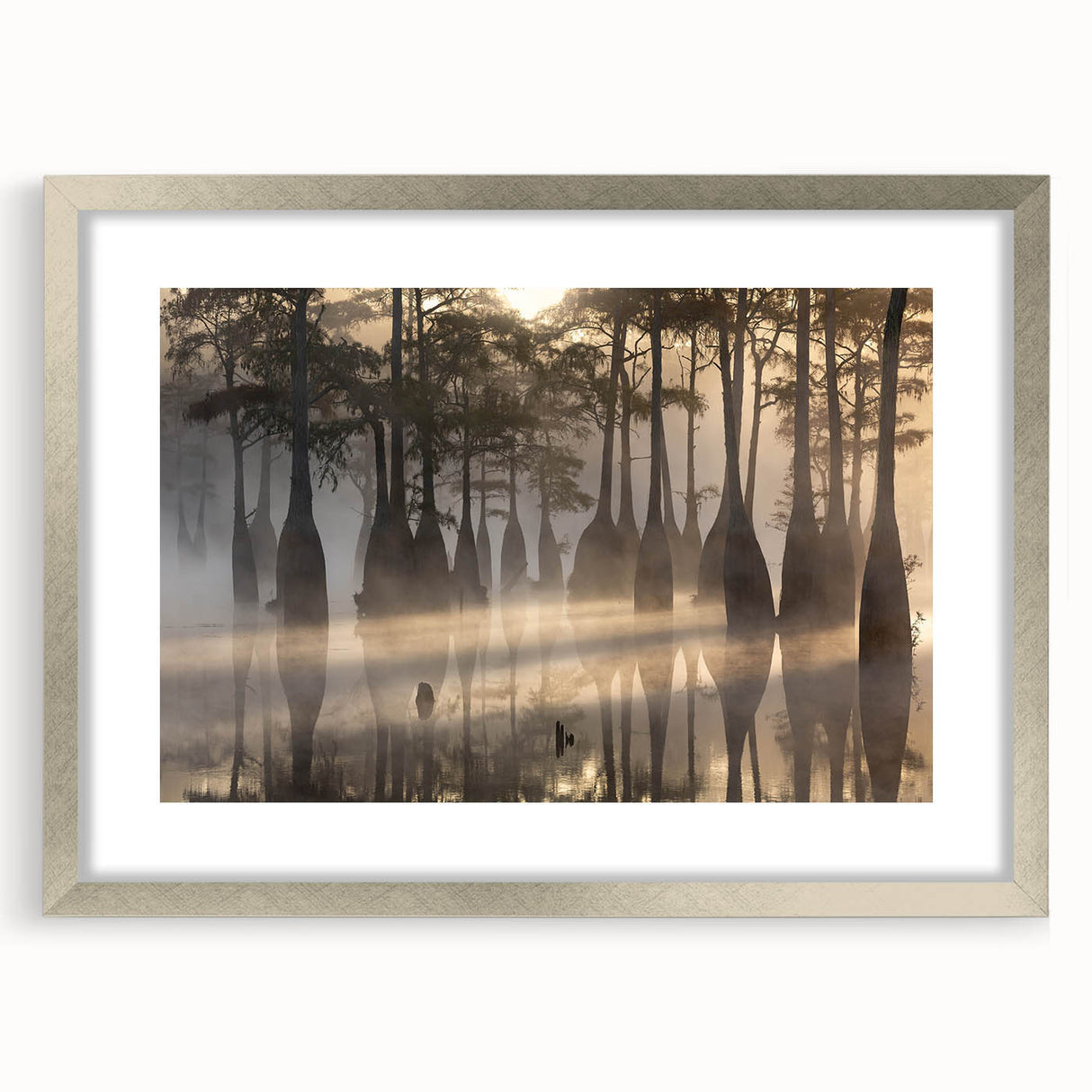 Framed wall art featuring a serene marsh landscape with lush greenery and reflective water, accented by a silver mat and frame, ideal for nature lovers.