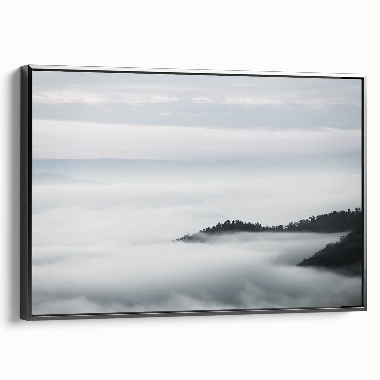 Framed canvas wall art showcasing a serene landscape design with mist and fog, featuring a black frame and a side view display, perfect for modern decor.
