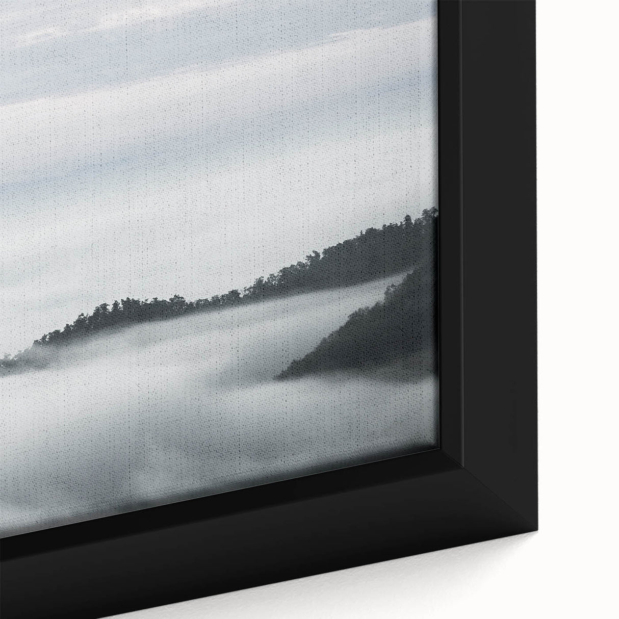 Framed canvas artwork showcasing a misty landscape design, featuring soft gray and blue hues, perfect for adding a serene touch to home decor.