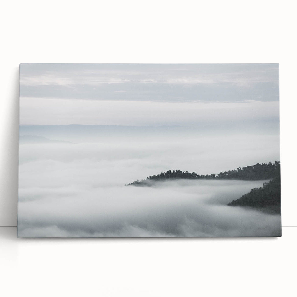 Stretched canvas wall art showcasing a misty landscape design with soft gray and blue hues, perfect for creating a serene atmosphere in modern home decor.
