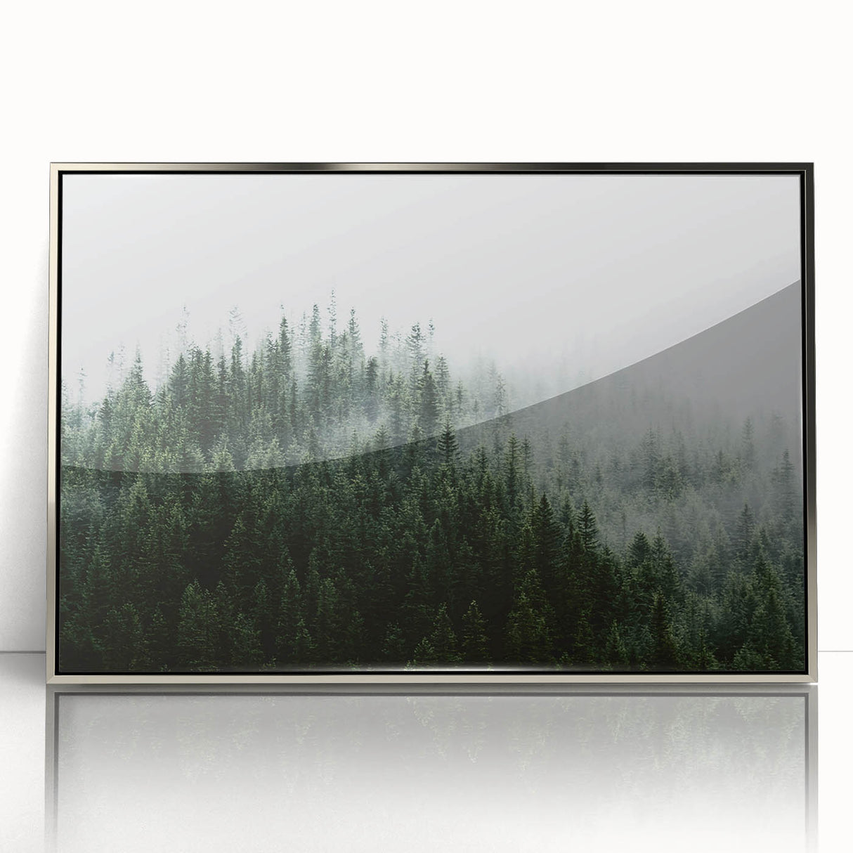 Framed wall art featuring a serene misty landscape design in soft gray and blue tones, showcasing nature's tranquility with a sleek silver frame, ideal for modern decor.