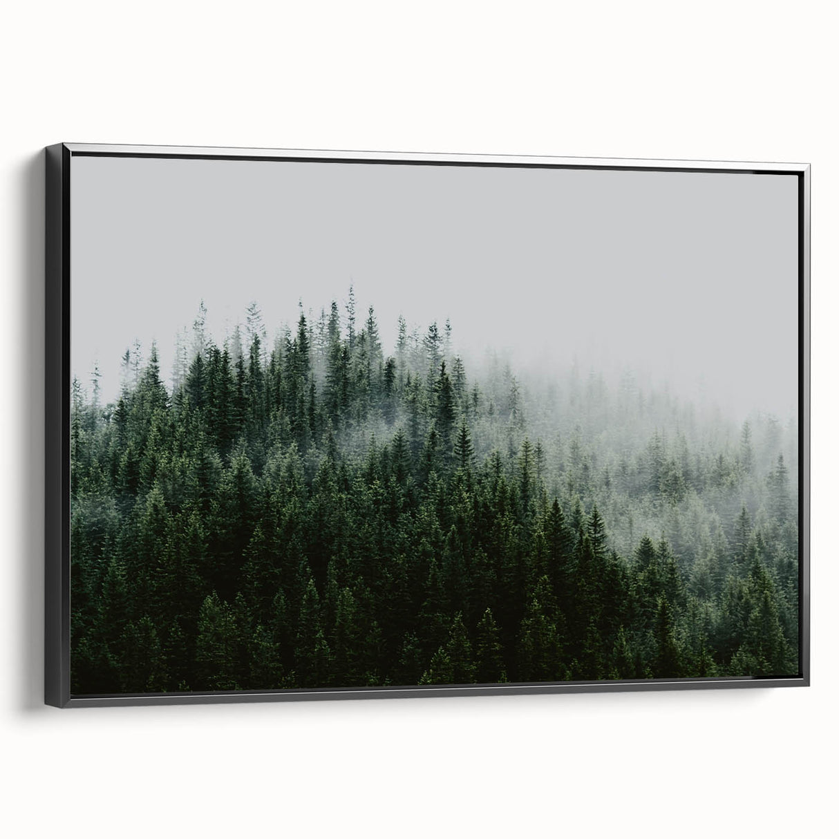 Framed canvas wall art depicting a serene landscape shrouded in mist, featuring soft grey and white tones, perfect for enhancing modern home decor.