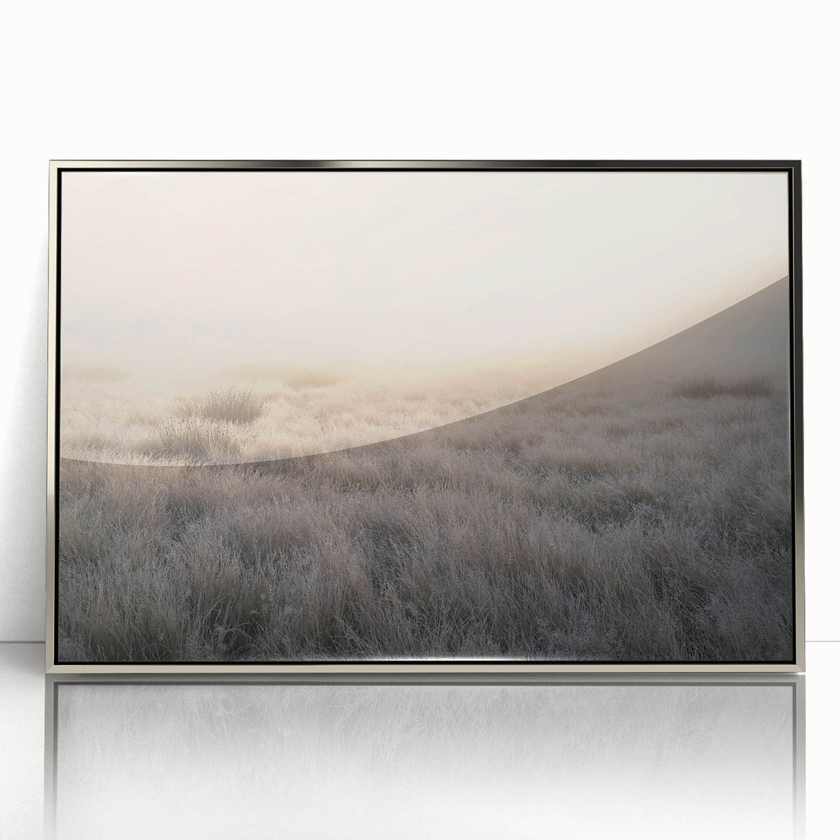 Framed acrylic wall art featuring a serene misty landscape design, showcasing soft gray tones and silver accents, perfect for modern home decor.