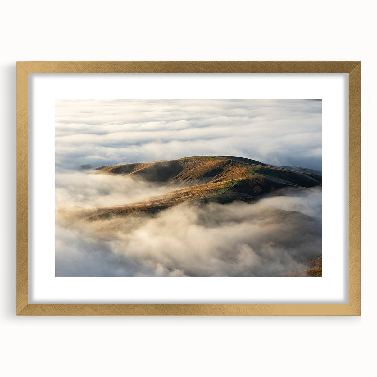 Framed wall art showcasing a serene landscape design with mist and fog, featuring a gold mat, ideal for enhancing home decor in modern settings.