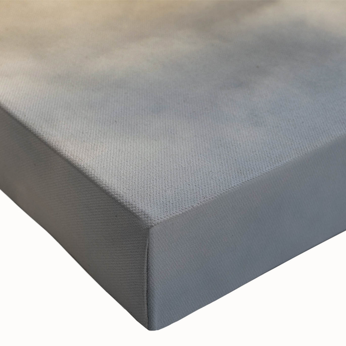 Close-up of a stretched canvas artwork showcasing a serene landscape design with mist and fog, featuring soft pastel colors, ideal for modern home decor.