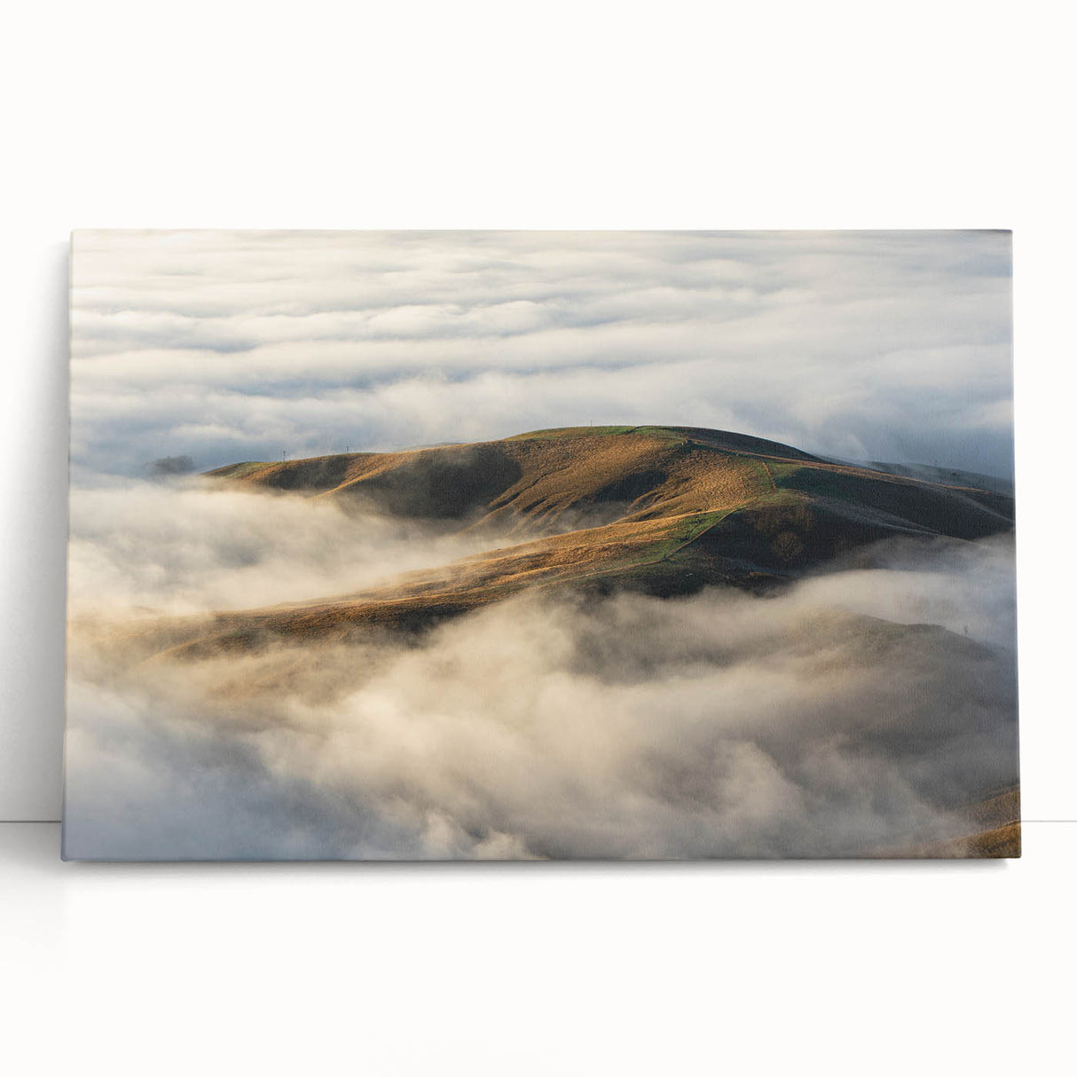 Stretched canvas artwork displaying a serene landscape with mist and fog, showcasing soft hues of gray and blue, perfect for enhancing modern home decor.