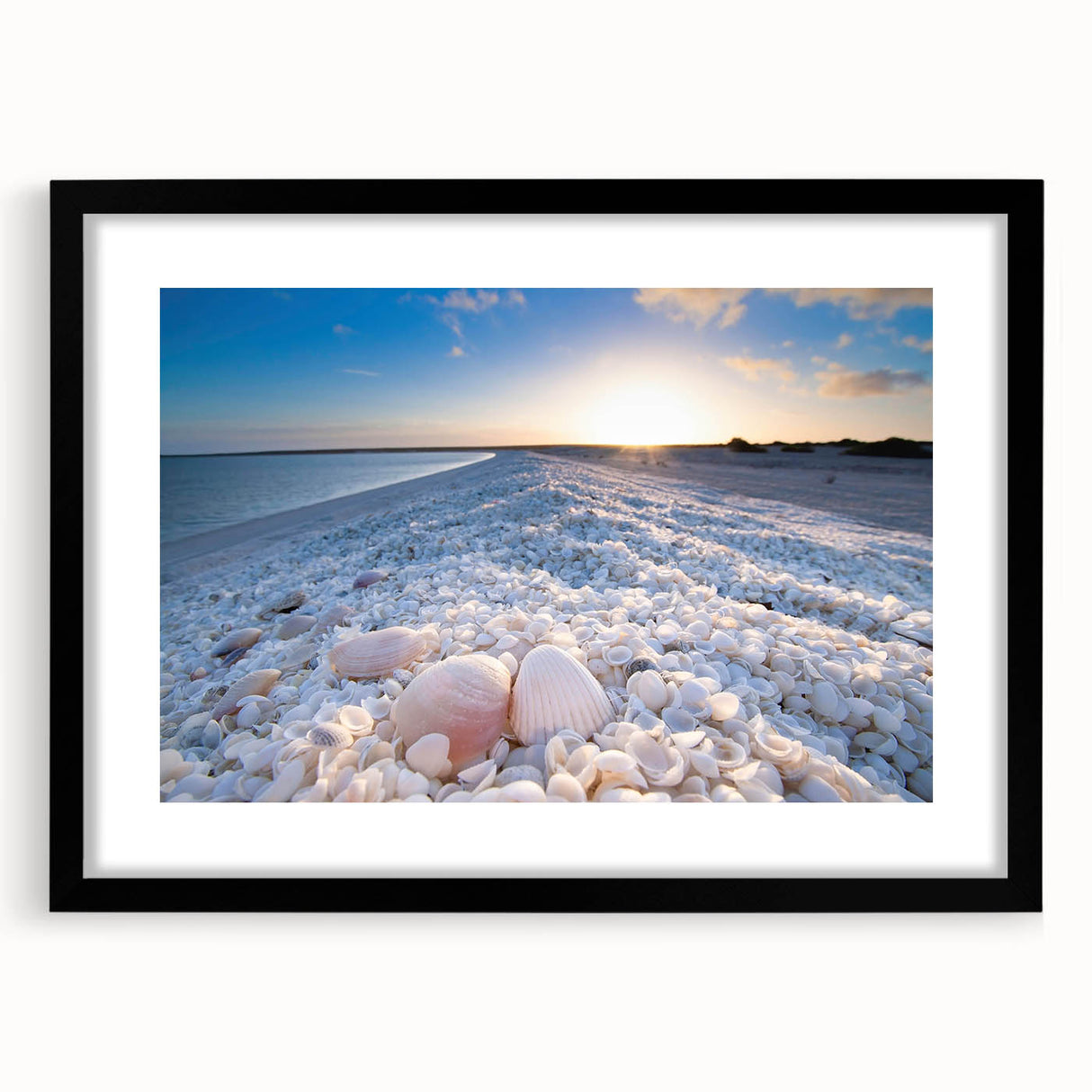 Framed wall art collection showcasing serene seascapes and landscapes in a black matte frame, enhancing any decor with a modern touch. Perfect for beach-themed interiors.